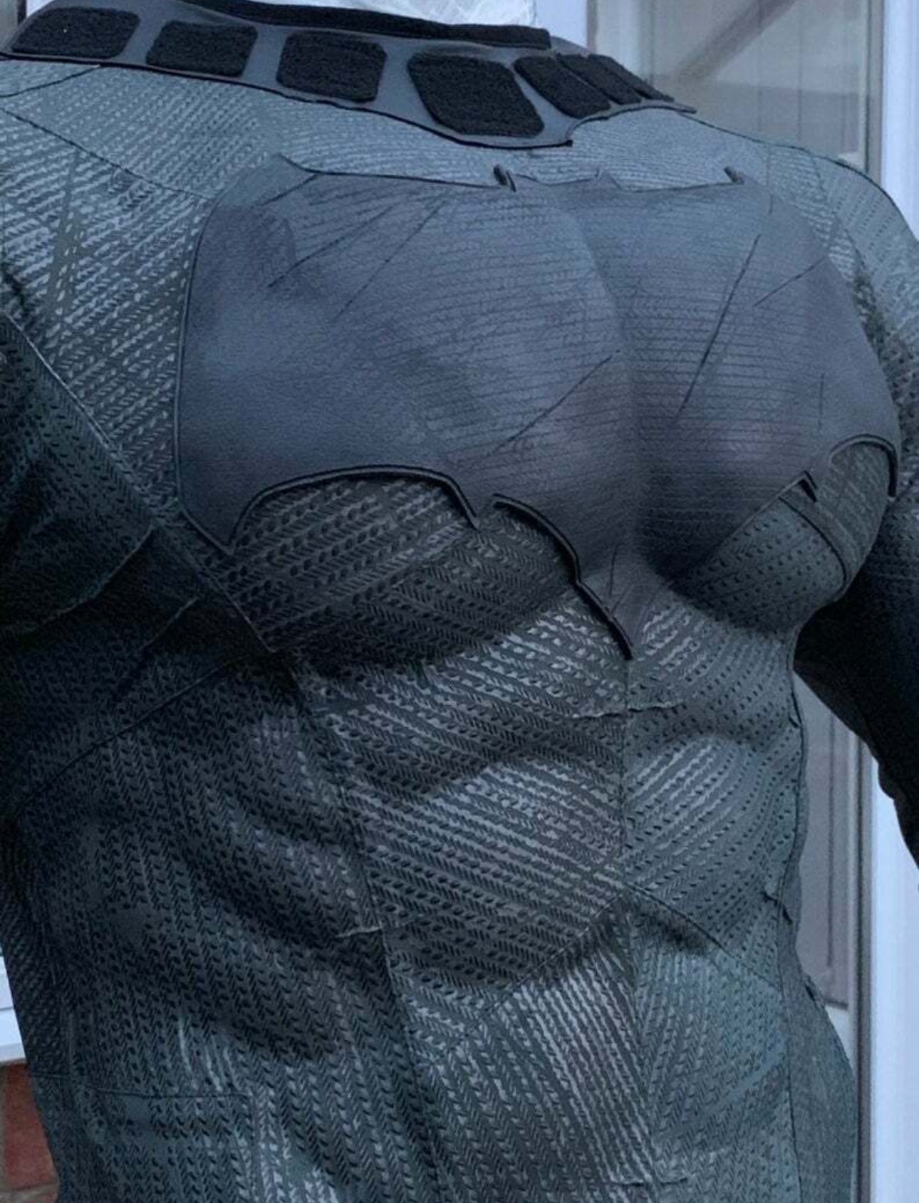 DOJ Muscles Suit and emblem